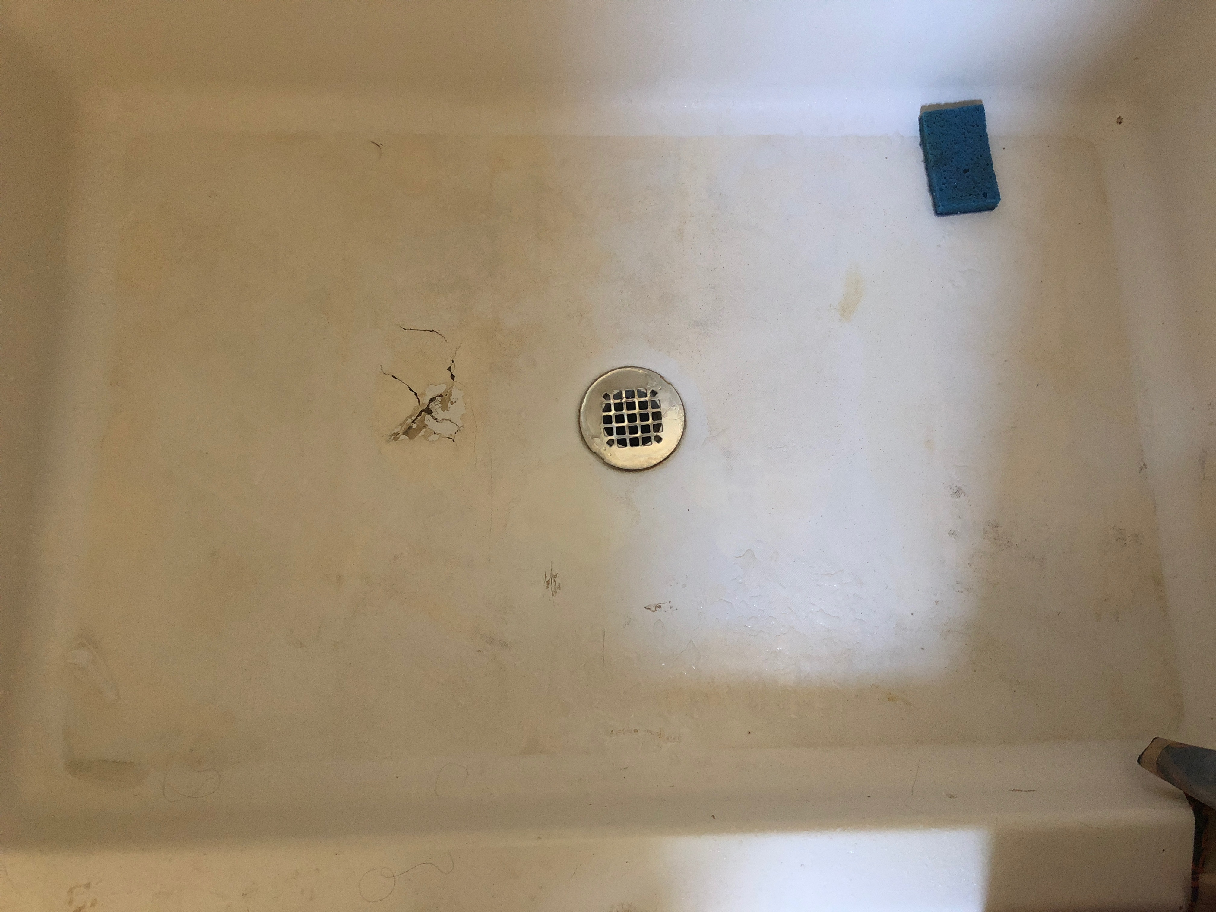 Shower resurfacing, shower pan spot repair before - NuFinishPro