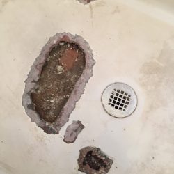 Shower resurfacing, shower pan spot repair before - NuFinishPro