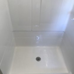 Shower pan resurfacing and wall after - NuFinishPro