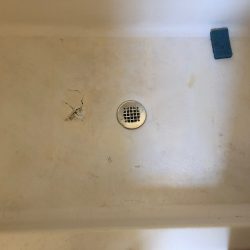 Shower resurfacing, shower pan spot repair before - NuFinishPro