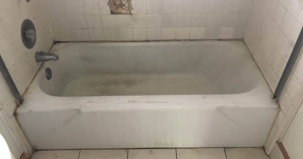 Bathtub refinishing, tile resurfacing, and spot repairs before work done - NuFinishPro